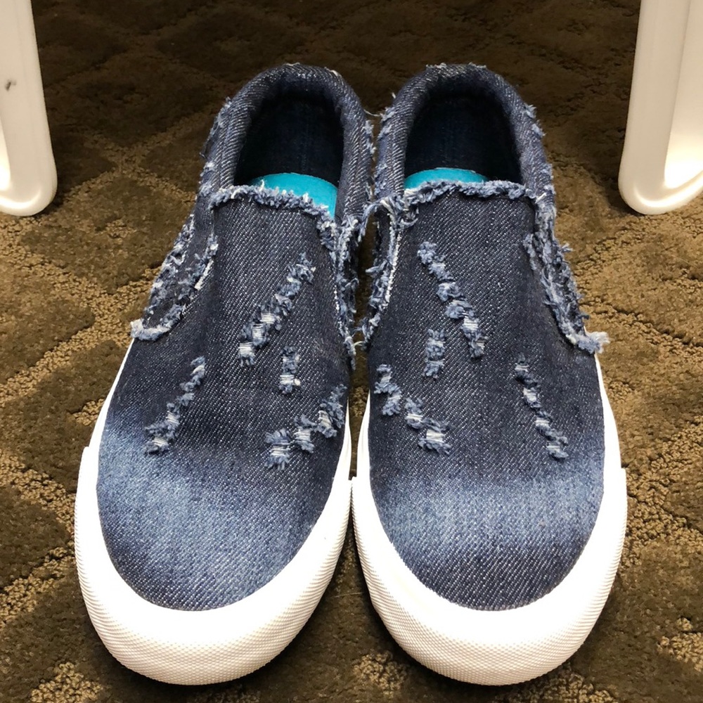Distressed denim slip on sneakers